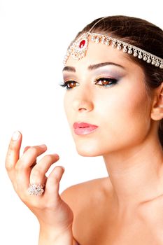 Hand in front of a beautiful Middle Eastern Egyptian Israeli Lebanese Turkish Arabic woman Face with makeup in the Belly Dancer style, isolated.