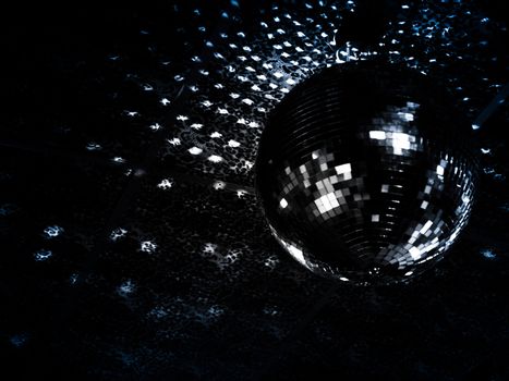 Mirrorball reflections on a ceiling of a night club. Focus on reflections. 