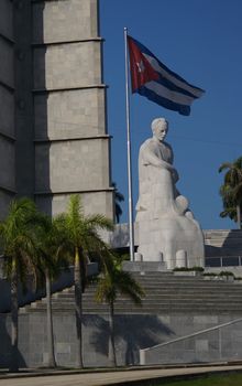 The Cuban flag, close to a monument