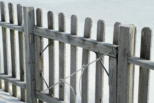 Close up of a split railed fech covered in frost.