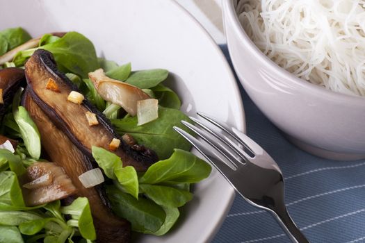 Warm mushroom salad on a bed of baby lettuce, served with cold soba noodles.