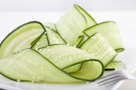 Japanese cucumber salad with rice vinegar and sesame seeds.