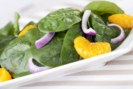 Fresh Spinach with mandarin oranges, red onions and a light orange honey dressing.