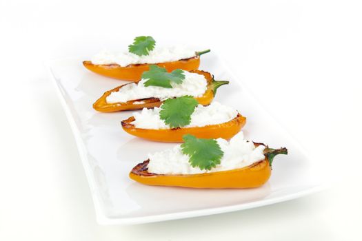 Spanish tapas, orange peppers stuffed with fresh ricotta cheese.