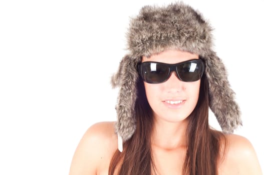 Studio shot of beautiful woman in fur hat