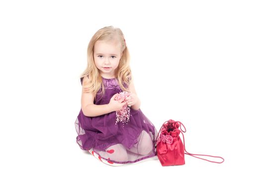 Studio shot of baby girl in lilac gala dress