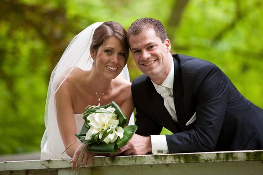 Bride on groom together on their weddingday looking happy