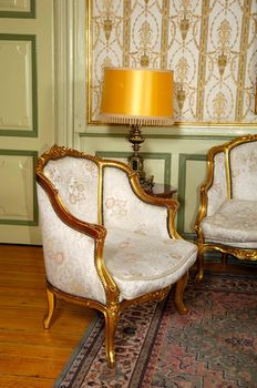 Elegant room with antique an armchair