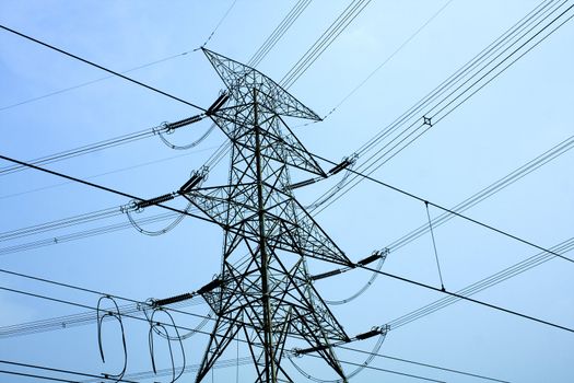 transmission tower with blue toned at day