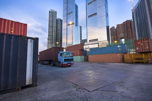 container site before modern building in city