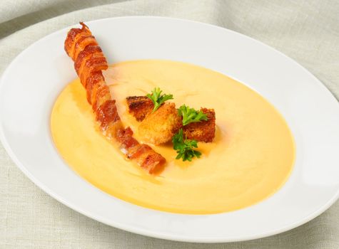 Delicious cheddar cheese and bacon soup with croutons.