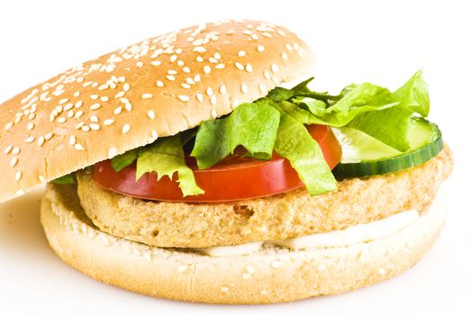 Chicken burger with tomato cucumber lettuce and mayonnaise over white