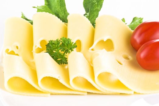 Sliced cheese with cherry tomatoes and lettuce