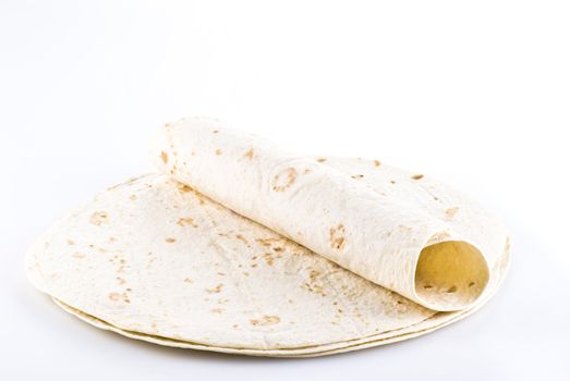 Stack of tortillas with one on the top - isolated