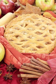 Delicious fresh baked apple pie with ingredients. Perfect for the holidays.