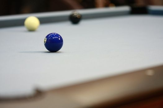 Pool with number 3 ball in focus shallow dof.