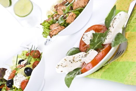 Freshly made salads with mozzarella salad on front