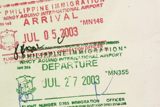 Arrival departure stamps in a Philippines passport.