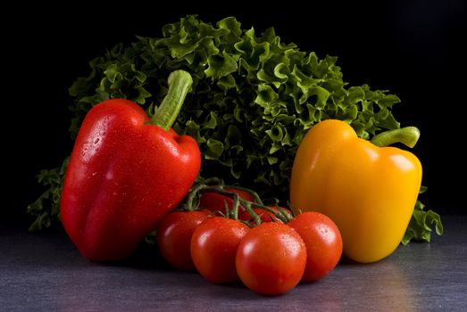 Fresh vegetables on a black background