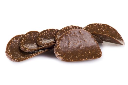 Chocolate chips isolated over white background