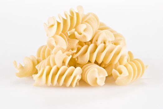 Fusilli pasta isolated over white background