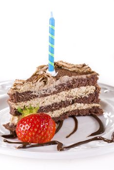 Birthday tiramisu cake isolated over white
