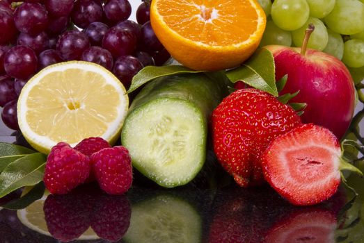 Fruits and cucumber in reflection