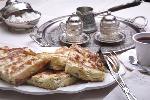 A table for Ramadan prepared and served with Borek and coffee