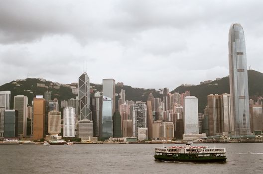 Hong Kong skyline view from victoria harbour, Star ferry that had been around 100 years is still cruising between Hong Kong and Kowloon everyday.