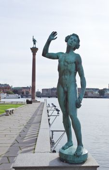 The statue on the river side of the Stockholm city hall