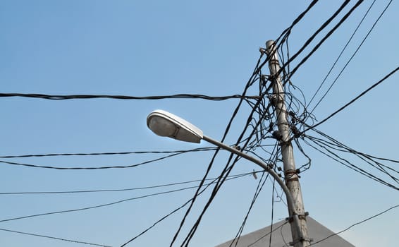 Streetlight pole with visible energy and telephony cables
