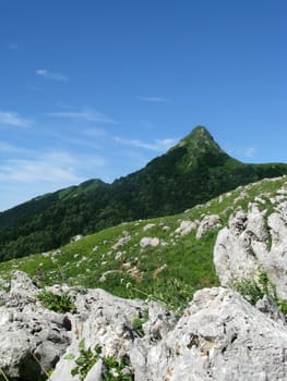 Mountains, rocks; a relief; a landscape; a hill; a panorama; Caucasus; top; a slope; clouds; the sky; a landscape