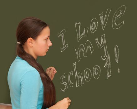 Schoolgirl English class at the blackboard.