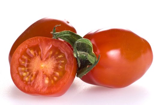 Red cherry tomatoes isolated on white