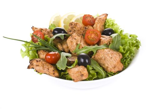 Chicken and vegetable salad isolated over white background