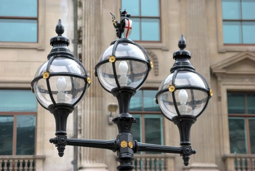 Three global street lights in city of London