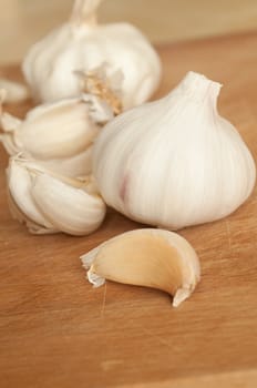 Closeup of Garlic on Wooden Chopping Board