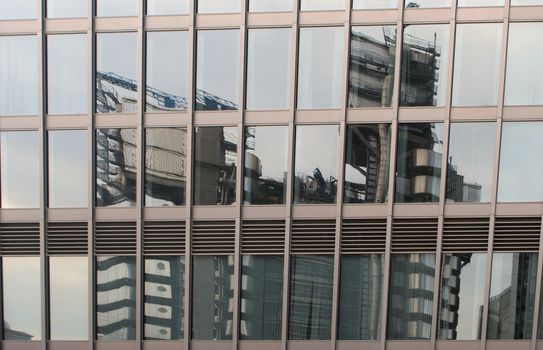 Lloyds of London insurance building reflectected in glass