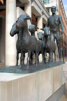 modern sculpture of shepherd asnd sheep near st pauls cathedral