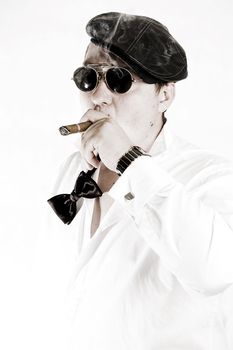 Macho man with cigar and sunglasses. High key.