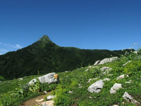 Mountains, rocks; a relief; a landscape; a hill; a panorama; Caucasus; top; a slope; clouds; the sky; a landscape