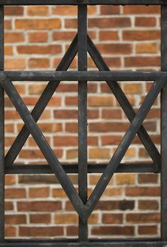 David's star over brick background in Cracow, Poland.