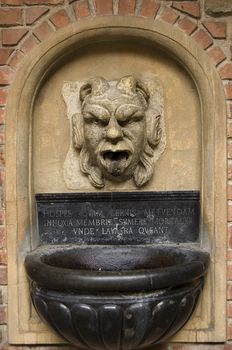 stone fountain sculpture in Cracow, Poland