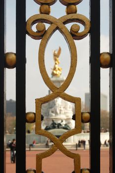 Queen Victoria's Memorial outside Buckingham Palace. View thru the gate