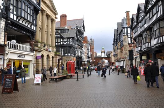 CHESTER, ENGLAND - FEBRUARY 11: Tourists and Shoppers in Chester England UK on a Dull Morning