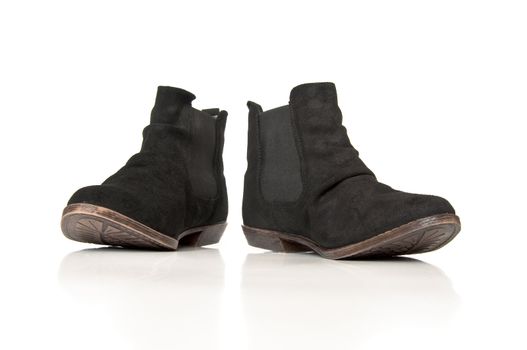 Black leathers boots on a white background