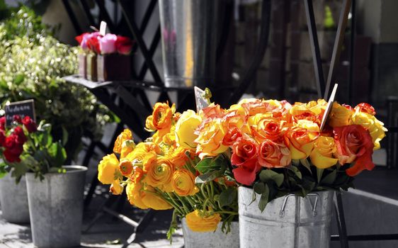 Orange and yellow roses on a florist stall