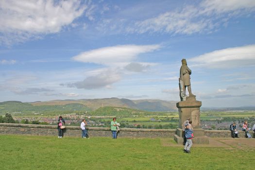 Tourists at Robert the Bruce Statue near Stirling Castle in Scotland UK