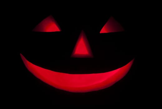 Halloween pumpkin in the night, red lighting