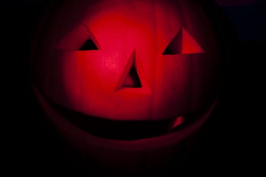 Halloween pumpkin in the night, red lighting